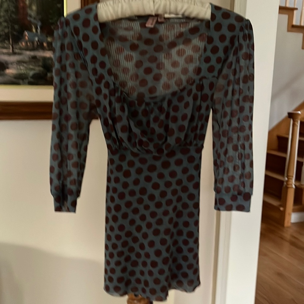 Light weight polka dot too that ties in the back. Stretchy fabric.
